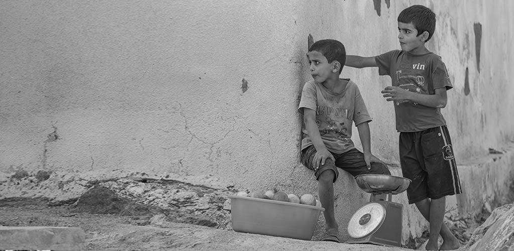 Image of sales teamwork communication and vision, entreupreneurial kids selling on a street corner